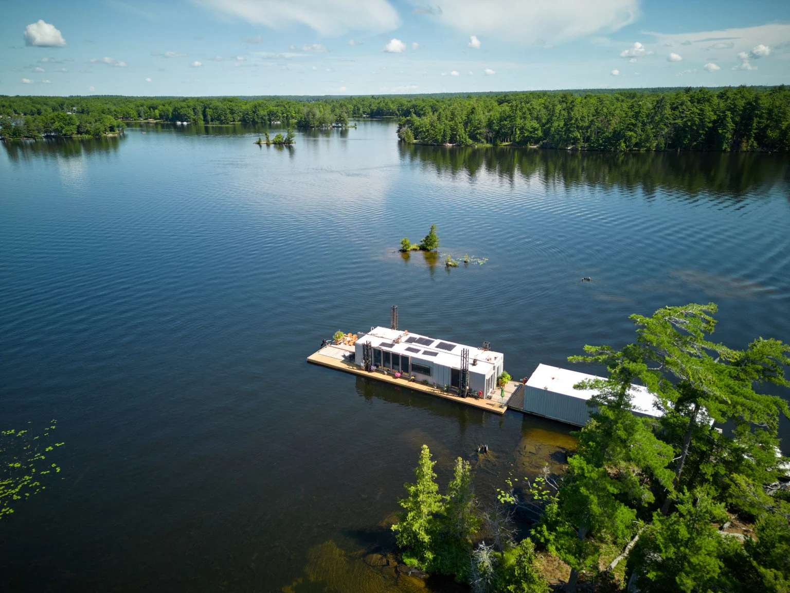 Photo of - Floating Home at the Centre of a Cottage Country Feud